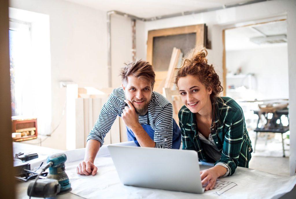 Couple planning home renovation on laptop using home equity line of credit for upgrades in Springfield MO